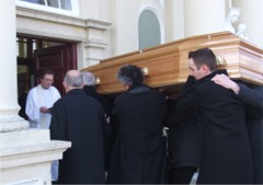 Fr. Fintan Diggin receives the remains of his brother, Cllr. Philip Diggin at St. Mary's Oratory, Buncrana.