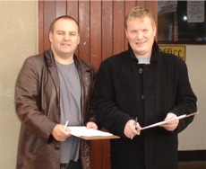 Sinn Fin Cllr Pdraig MacLochlainn and local party candidate Sean Ruddy conduct their survey outside Carn Mart.
