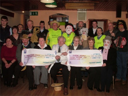  'King Mummer' Desmond Stewart and the Sheephaven Mummers hand over cheques to the Donegal Hospice and Adrian Mitchell Society following their successful Christmas fundraiser around Donegal including Inishowen.