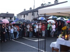 Some of the large crowd at the open air Mass in Knockalla Drive.