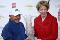 Spain's Juan Quiros receives the Irish Seniors Open trophy from An Tanaiste, Mary Coughlan.