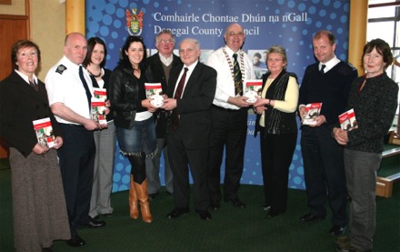 Some of those who helped administer the Community Smoke Alarm Scheme. Included in photo are Jim Henderson, fifth from left, and Margaret Glackin, third from right.