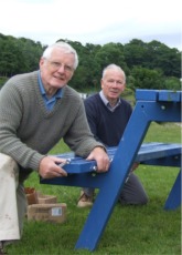 From left, Lawrence McGonagle and Willie McMullan installing one of the new summer seats on Moville Shore Green.