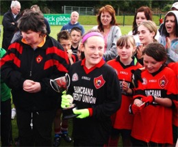 A delighted Urris captain Shannon Devlin accepts the cup and makes her winning speech.