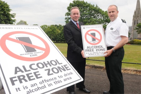 City solicitor Damien McMahon and PSNI Chief Inspector Chris Yates pictured with the new Alcohol Free Zone signs that have been erected throughout the city.