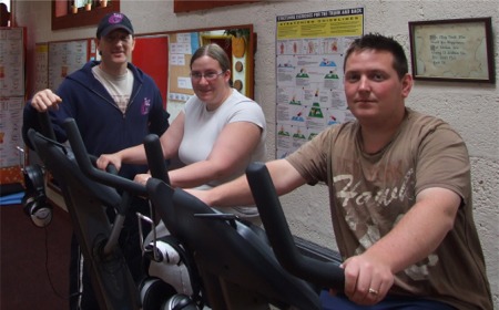 Sharon and Eddie limber up for their weight-loss challenge with the help of Peter Doherty.