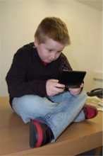 Luke Kelly from Buncrana tries the Nintendo DS Lite for size.