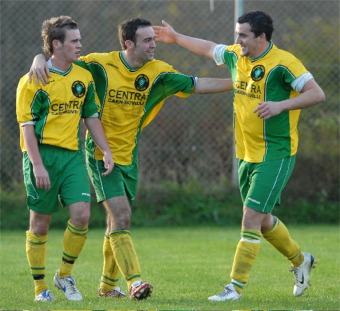 Charlie McCormick and Philip McGuinness congratulate Eddie McIntyre after he opened the scoring for Inishowen.