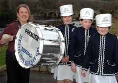 Senator Cecilia Keaveney celebrates the funds boost with members of the Buncrana Youth Accordian Band.