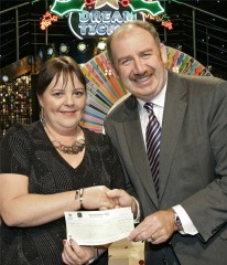 Peter Plunkett of the National Lottery presents Bernie Kearney with her Winning Streak cheque of 50,750.