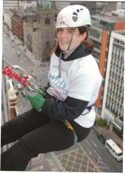 Mary Mooney abseiling down the outside of the Europa Hotel in Belfast
