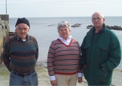 Pictured at Portaleen Pier are Cllr Marian McDonald, John McDermott, former harbour master at Portaleen Pier and, far right, Charlie O'Donnell, chair of Malin Head Fisherman's Co-Op.