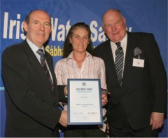 ICRfm's Trudy McLaughlin picks up the Regional Media Award on behalf of the station from Minister Michael Kitt TD, left, and IWS chairman Frank Nolan, at a ceremony in Dublin Castle.