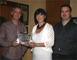 Michelle McCann and her son Barry present the Dan McCann Cruising Shield to Garvan Meehan for his 2009 cruising log. Photo by Michael Doherty.
