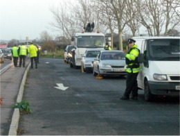PSNI officers accompany DVLA officals at the border crossing between Bridgend and Coshquin.