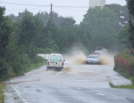 Vehicles battle through several feet of flooding at Poundtown on the Upper Road, Greencastle.