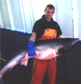Mark Duffy shows off one of his catches while working in Scotland.