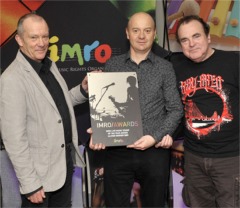 Neil McGrory of McGrory's, Culdaff, picks up the Ulster Venue of the Year award at a special ceremony in Dublin last week from, left, IMRO representative Keith Donald and Niall Toner.