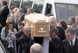 Paul Houston's remains carried by his three sons and friend Philip Devlin are carried into Ballybrack church.
