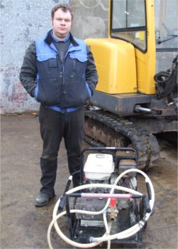 Bernard Quigg pictured with a Honda petrol power washer similar to the four stolen in the recent raid.