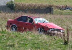 The vehicle involved in Sunday's crash lies in the field at Bankhead, Clar, Redcastle.