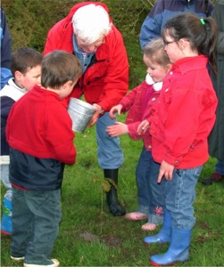 Children and adults take part in a recent Transition Inishowen Tree Planting Party.