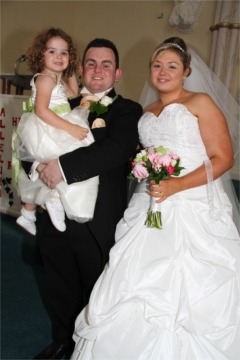 Chris and Toni McFadden pictured on their wedding day with their pretty flowergirl and daughter Alix.