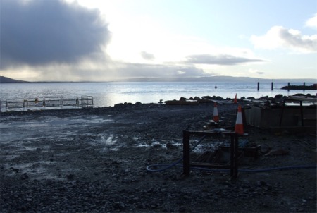Work grinds to a halt at the Greencastle breakwater scheme.